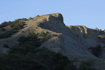 Mountains at sunset on the coast of the New World in Crimea. Trail of Prince Golitsyn