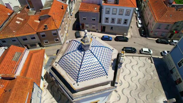 Beautiful Aerial view of the dome of Capela De Sao Goncalo against the Typical Portugal old houses rooftops in Aveiro city. Portugal