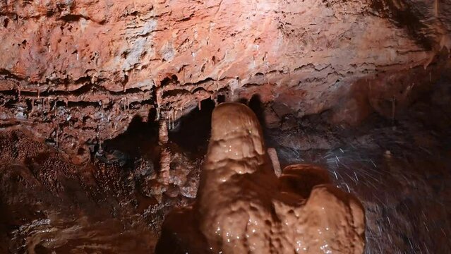Cave formation flowstone stalagmite grows as groundwater filters through limestone depositing calcite creating flowstone in cave networks throughout the Ozarks in the USA. 