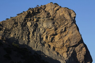 Mountains at sunset on the coast of the New World in Crimea. Trail of Prince Golitsyn