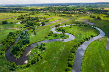 Fototapeta na wymiar Curvy River Bends. Nida in Poland. Aerial Drone View