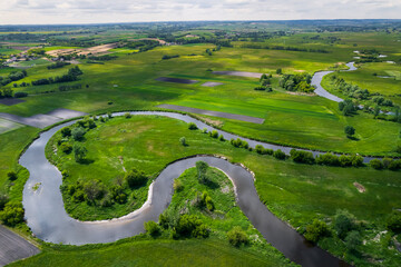 Wild Nida River in Poland Countryside at Spring. Aerial Drone View - obrazy, fototapety, plakaty