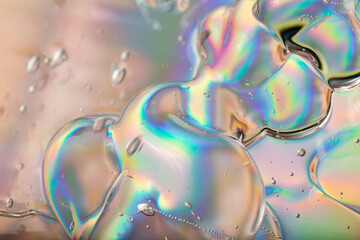 Abstract cosmetics gel on holographic background.Good as cosmetic banner.