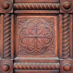 wooden ornament with decorative natural motifs engraved inside a circle and framed for an elegant...