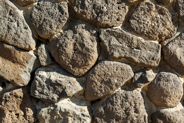 Fragment of a wall with a stone texture