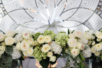 Row of bouquets of flowers on a wedding table