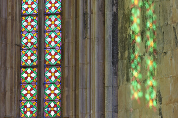 stained glass windows and pillars in Interior of the Unfinished chapels in Batalha monastery,...