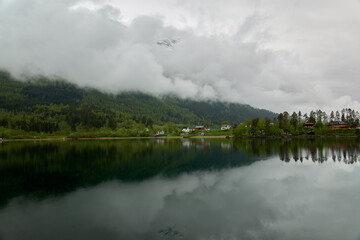Obraz na płótnie Canvas Norwegian fjords. Atmospheric spring in Norway. Jostedalsbreen National Park. Reflection.