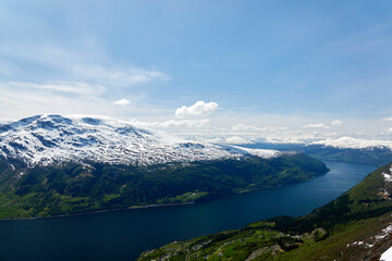 Naklejka na ściany i meble Norwegian fjords. Lake. Spring. Snow. 