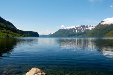 Fototapeta na wymiar Norwegian fjords. Lake. Spring. Snow. 