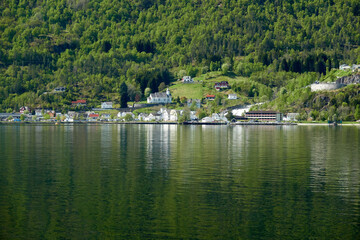 Fototapeta na wymiar Geirangerfjord. Spring in the Norwegian fjord. Hellesylt's view
