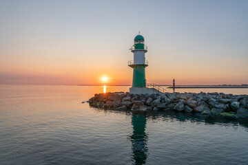 Lighthouse Molenfeuer Westmole at sunrise, Warnemünde, Rostock, Mecklenburg-Vorpommern, Germany