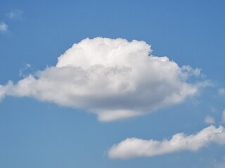 Naklejka na ściany i meble White cloud on blue sky. single cloud with sunny and blue sky background