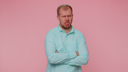 Dissatisfied man shaking head no, asking reason of failure, expressing disbelief irritation,...