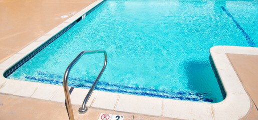 Fototapeta na wymiar blue water in summer swimming pool. summer vacation