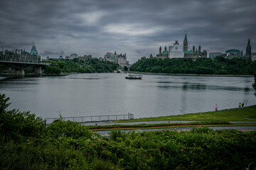 Fototapeta na wymiar A view of the Ottawa river and Parliament hill in the capital of Canada