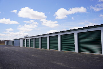Fototapeta na wymiar Green door storage units for the community to use.