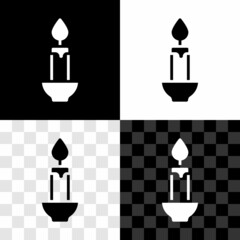 Set Burning candle icon isolated on black and white, transparent background. Cylindrical candle stick with burning flame. Vector