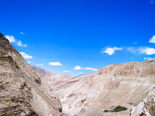 Beautiful view of the sand mountains with blue sky and clouds 