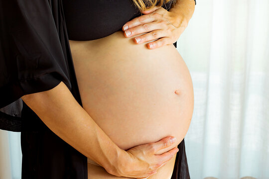 woman holding belly