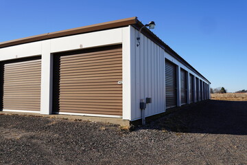 Fototapeta na wymiar Storage unit buildings sit outside holding the owner's property.