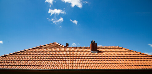 new red tiles roof and blue sky