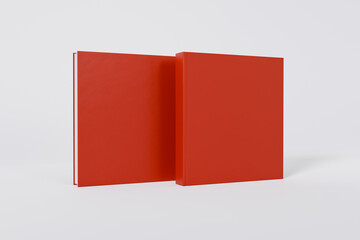 Mockup of a square book with a blank glossy red cover on white background. Front and back cover visible. Isolated with clipping path.