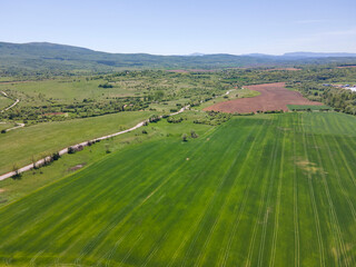 Fototapeta premium Spring Aerial view of rural land near town of Godech, Bulgaria
