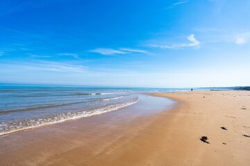 Sandy beach with blue sky, seaside