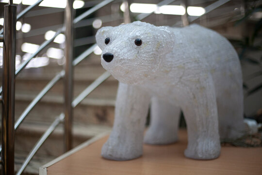 Toy polar bear. Figurine for interior decoration. The extremely arctic sea dweller.