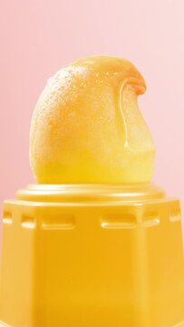 beauty mango shape and mango flavor popsicle melting on yellow timelapse at vertical composition