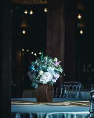 Bouquet on the banquet table. vertical photo