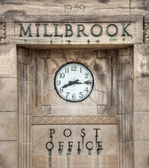 Clock on old post office building in Millbrook Ontario Canada