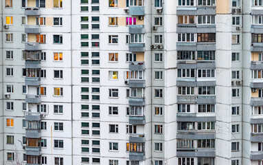 Windows of multi-storey panel residential buildings in a residential area of a large city.