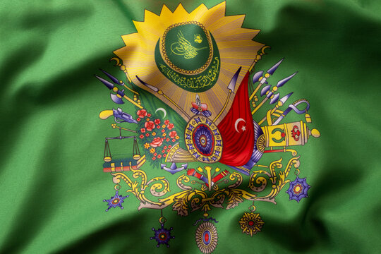 Islamic royalty, turkish history and muslim heraldic emblem concept with moody photograph of waving green textile flag of the old ottoman empire with ornate coat of arms