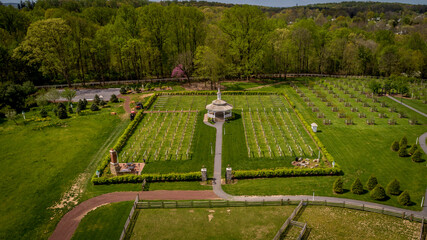 Aerial View of a New Orchard and Vineyard With a Gazebo on Beautiful Grounds on a Sunny Day
