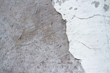 Old wall with a crack.Grunge background in dark color.