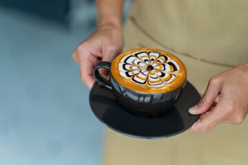 hot latte art coffee on hand table, relax time