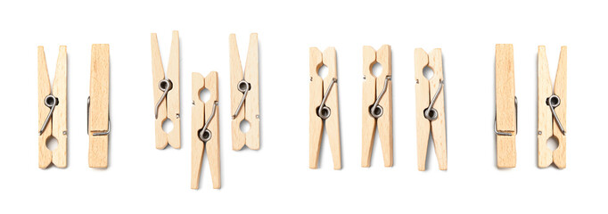 Many wooden clothespins isolated on white