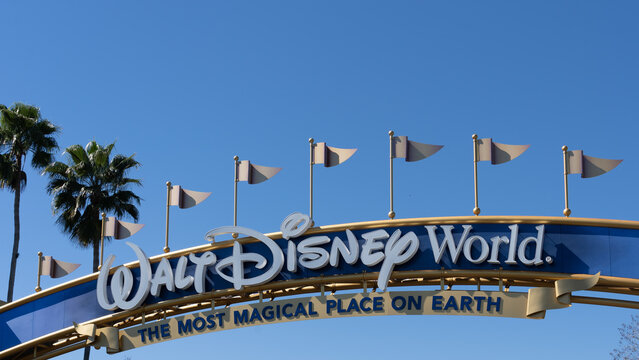 Orlando, Florida, USA - February 9, 2022:  Closeup of Walt Disney World sign on the arch gate in Orlando, Florida, USA. Walt Disney World is an entertainment resort complex.