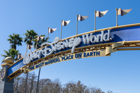 Orlando, Florida, USA - February 9, 2022:  Closeup of Walt Disney World sign on the arch gate in Orlando, Florida, USA. Walt Disney World is an entertainment resort complex.