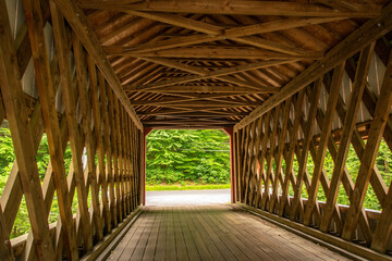 View of a Covered Bridge's Timber Frame Construction on a Cloudy Day