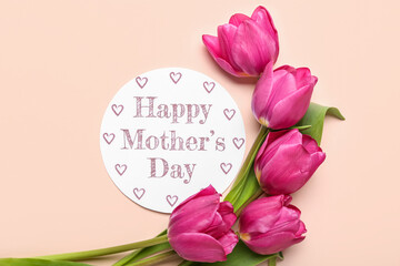 Card with text HAPPY MOTHER'S DAY and tulips on pink background