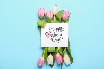 Card with text HAPPY MOTHER'S DAY and tulips on blue background