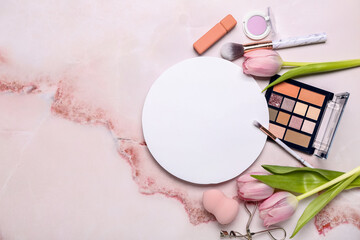 Composition with blank card, decorative cosmetics and tulips on color background