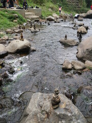 Obraz premium Rock balancing, the art of stacking stones piled in the river