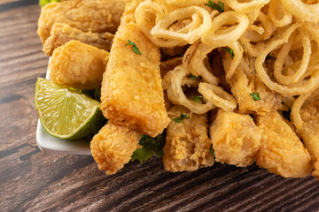 Appetizer - portion of fish with onion rings