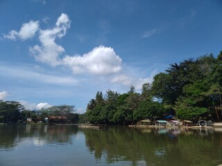 Fototapeta na wymiar Photo of the scenery around the Cangkuang tourist spot taken on a raft