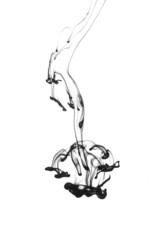 Black ink dropped into water isolated on white background。