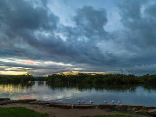 Rainy day sunset with clouds at the waterfront